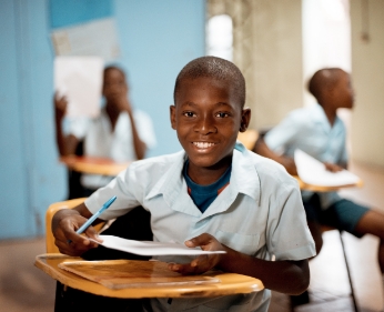 shallow focus shot african child learning school